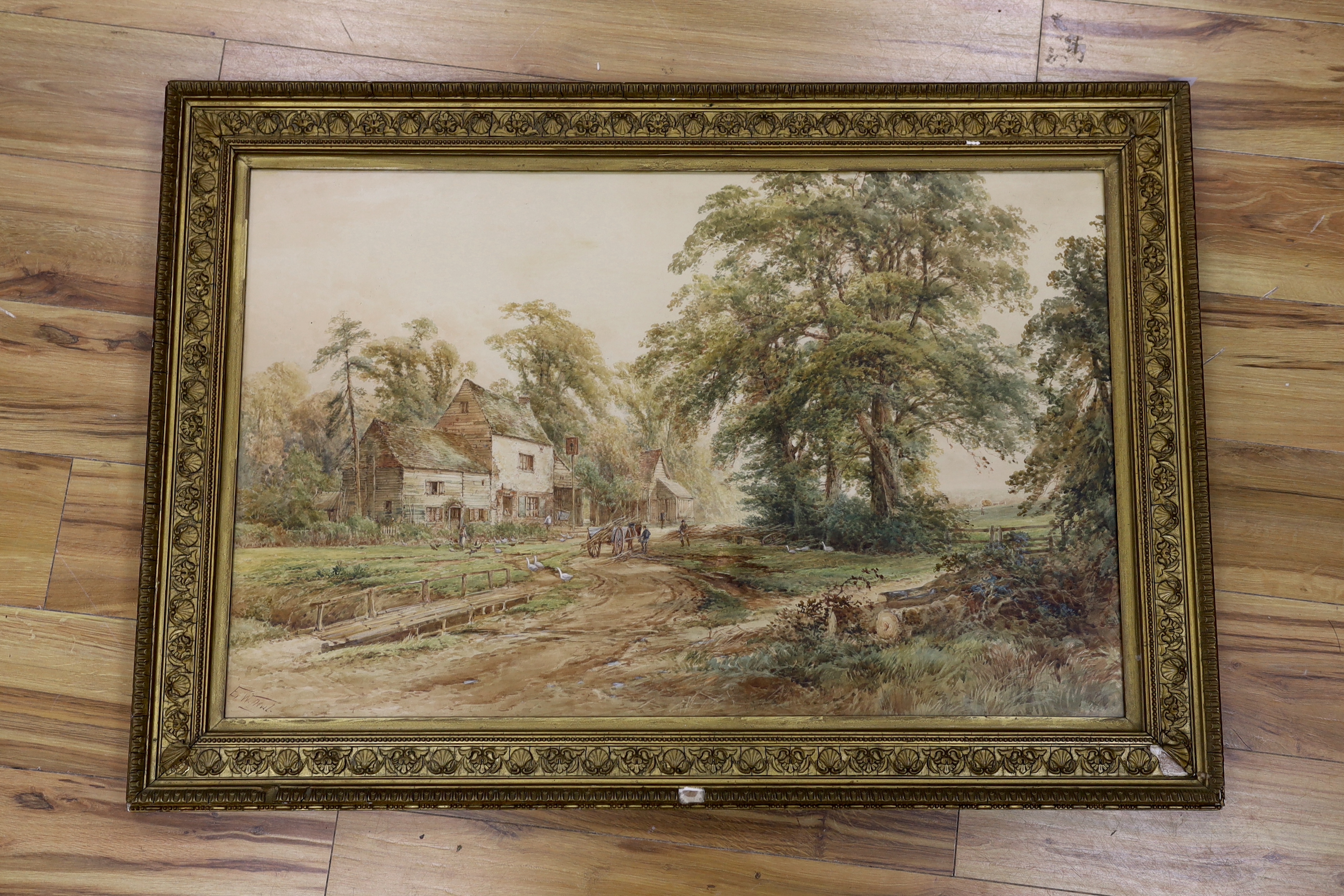 E. W. Nevil (19th. C), Victorian heightened watercolour, Pathway before buildings, signed, 58 x 90cm